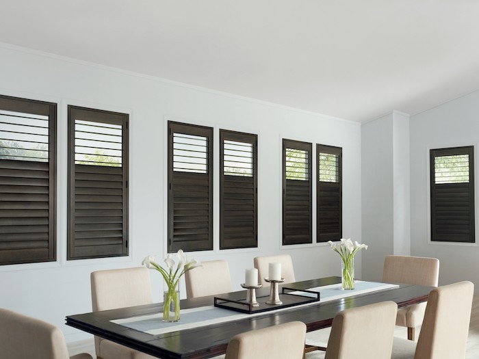 Dining room with espresso brown shutters.